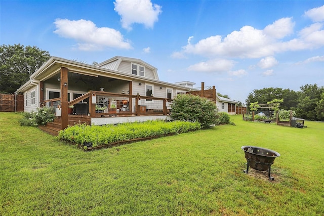 4009 Seminole Trl, Granbury, TX 76048 - back of property with a wooden deck, a yard, and a gambrel roof