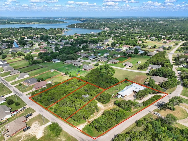 4009 Seminole Trl, Granbury, TX 76048 - aerial view of residential area featuring a large body of water and property boundaries highlighted