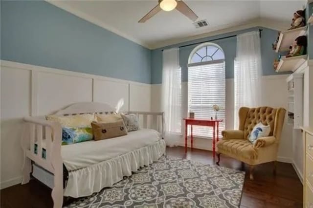 14 E Hillside Pl, Trophy Club, TX 76262 - bedroom featuring a decorative wall, wood finished floors, wainscoting, and ceiling fan