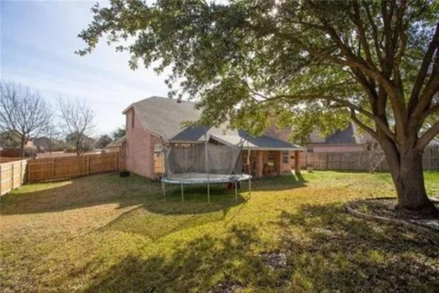 14 E Hillside Pl, Trophy Club, TX 76262 - view of yard featuring a trampoline