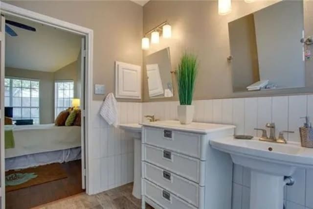 14 E Hillside Pl, Trophy Club, TX 76262 - ensuite bathroom featuring wainscoting, wood finished floors, and vaulted ceiling