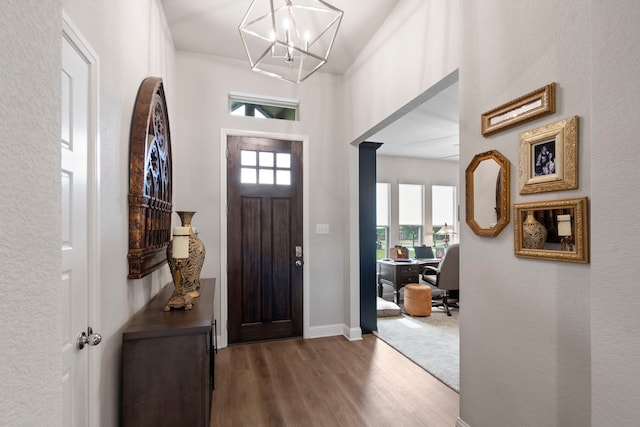 105 Aslan Rd, Poolville, TX 76487 - foyer with wood finished floors, a chandelier, and baseboards