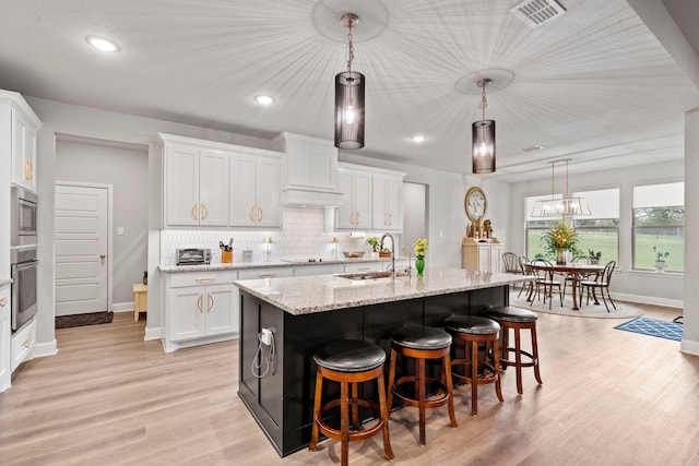 105 Aslan Rd, Poolville, TX 76487 - kitchen featuring a sink, appliances with stainless steel finishes, baseboards, white cabinets, and recessed lighting