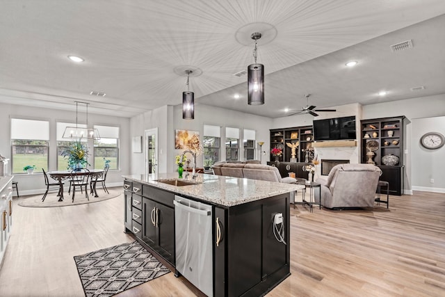 105 Aslan Rd, Poolville, TX 76487 - kitchen featuring stainless steel dishwasher, a sink, dark cabinets, light wood-type flooring, and a ceiling fan