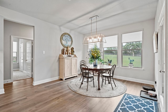 105 Aslan Rd, Poolville, TX 76487 - dining room with wood finished floors, a chandelier, plenty of natural light, and baseboards