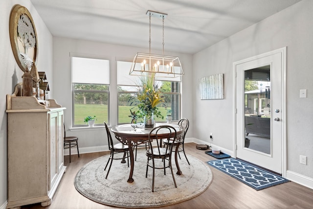 105 Aslan Rd, Poolville, TX 76487 - dining room featuring light wood-type flooring, a chandelier, and baseboards