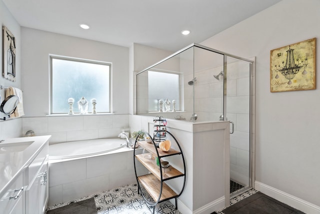 105 Aslan Rd, Poolville, TX 76487 - bathroom featuring tile patterned flooring, a bath, a shower stall, vanity, and recessed lighting