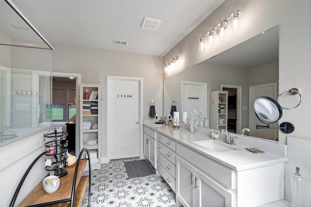 105 Aslan Rd, Poolville, TX 76487 - full bath with double vanity and tile patterned flooring