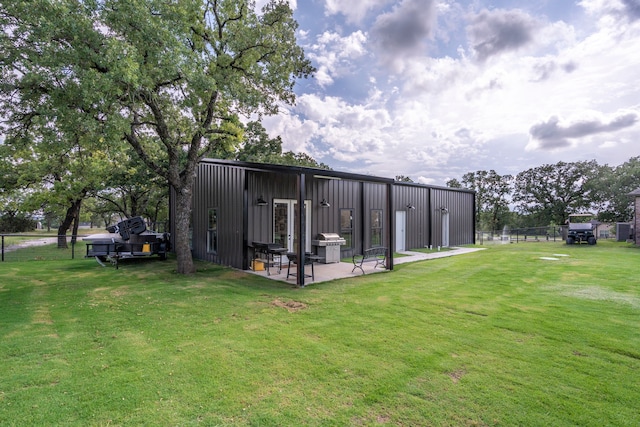 105 Aslan Rd, Poolville, TX 76487 - back of property featuring board and batten siding and a patio area