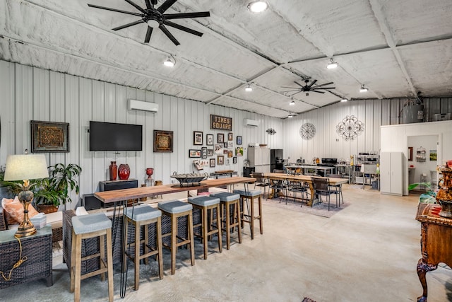 105 Aslan Rd, Poolville, TX 76487 - bar area with a ceiling fan, concrete flooring, a wall mounted AC, and an AC wall unit