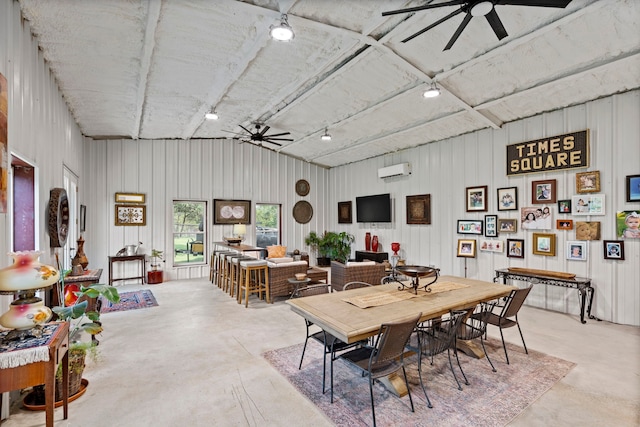 105 Aslan Rd, Poolville, TX 76487 - dining room featuring a ceiling fan, finished concrete flooring, a wall mounted air conditioner, lofted ceiling, and rail lighting
