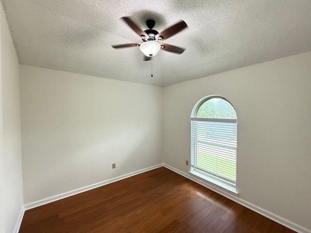 617 Desoto Dr, Desoto, TX 75115 - spare room with dark wood finished floors, ceiling fan, a textured ceiling, and baseboards