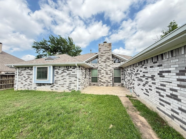 617 Desoto Dr, Desoto, TX 75115 - rear view of property featuring a patio, brick siding, a shingled roof, and a chimney