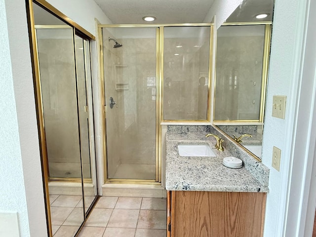 617 Desoto Dr, Desoto, TX 75115 - full bath featuring vanity, a stall shower, and tile patterned flooring