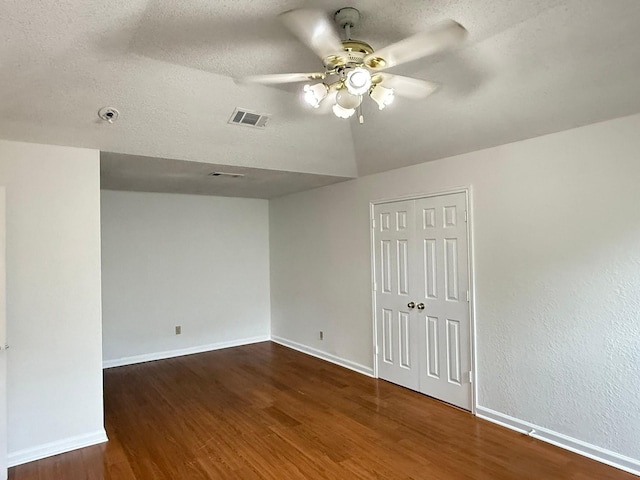 617 Desoto Dr, Desoto, TX 75115 - unfurnished room featuring wood finished floors, a ceiling fan, baseboards, and a textured ceiling
