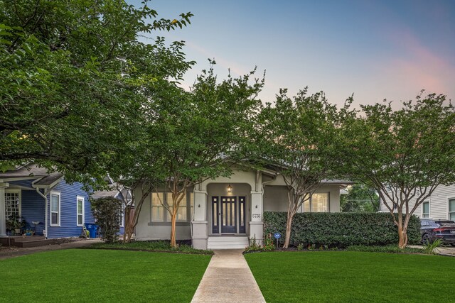 5735 Belmont Ave, Dallas, TX 75206 - obstructed view of property featuring stucco siding and a lawn