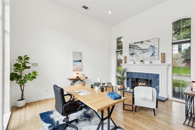 5920 Loch Lomond Dr, Plano, TX 75093 - home office featuring plenty of natural light, light wood-type flooring, a fireplace, baseboards, and recessed lighting