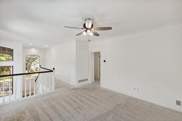 5920 Loch Lomond Dr, Plano, TX 75093 - spare room featuring ornamental molding, a ceiling fan, light colored carpet, baseboards, and recessed lighting