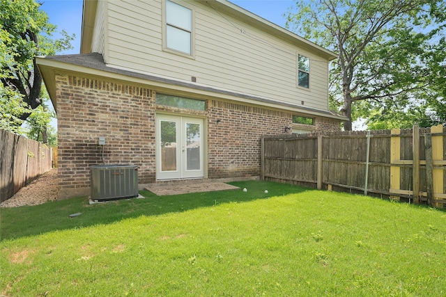 3116 Frazier Ave, Fort Worth, TX 76110 - rear view of house featuring central AC, brick siding, and french doors