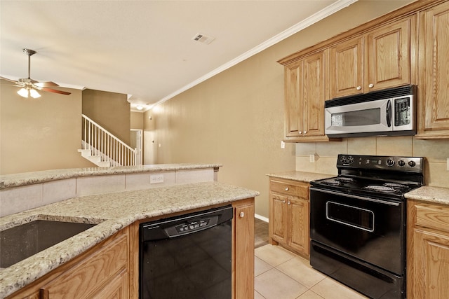 3116 Frazier Ave, Fort Worth, TX 76110 - kitchen featuring black appliances, crown molding, decorative backsplash, light tile patterned floors, and light stone countertops