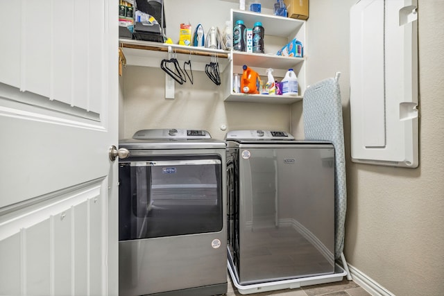 404 Madrone Ln, Princeton, TX 75407 - laundry area with washer and dryer, baseboards, and wood finished floors