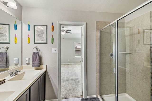 404 Madrone Ln, Princeton, TX 75407 - full bath with double vanity, a shower stall, and a ceiling fan
