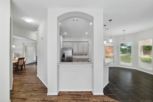 3402 Blue Forest Dr, Arlington, TX 76001 - kitchen featuring stainless steel fridge with ice dispenser, dark wood-style flooring, baseboards, hanging light fixtures, and recessed lighting