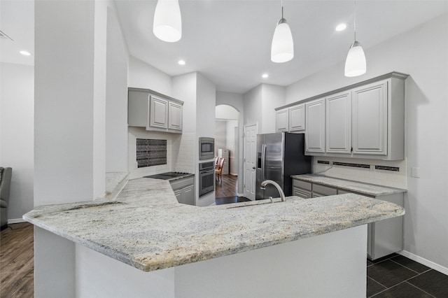 3402 Blue Forest Dr, Arlington, TX 76001 - kitchen featuring appliances with stainless steel finishes, gray cabinetry, baseboards, a sink, and a peninsula