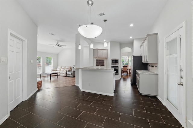 3402 Blue Forest Dr, Arlington, TX 76001 - kitchen featuring stainless steel appliances, light countertops, healthy amount of natural light, open floor plan, and recessed lighting