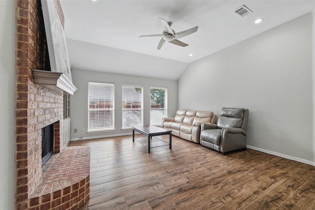 3402 Blue Forest Dr, Arlington, TX 76001 - living area with a ceiling fan, lofted ceiling, wood finished floors, a fireplace, and baseboards