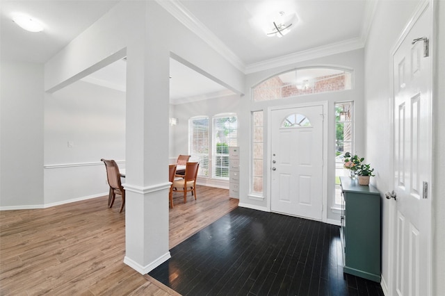 3402 Blue Forest Dr, Arlington, TX 76001 - foyer with dark wood-type flooring, plenty of natural light, crown molding, a chandelier, and baseboards