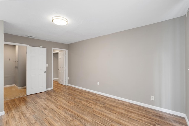 2363 Talco Dr, Dallas, TX 75241 - unfurnished bedroom featuring baseboards and light wood-type flooring