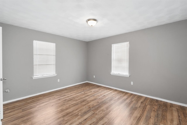 2363 Talco Dr, Dallas, TX 75241 - unfurnished room with wood finished floors, baseboards, and healthy amount of natural light