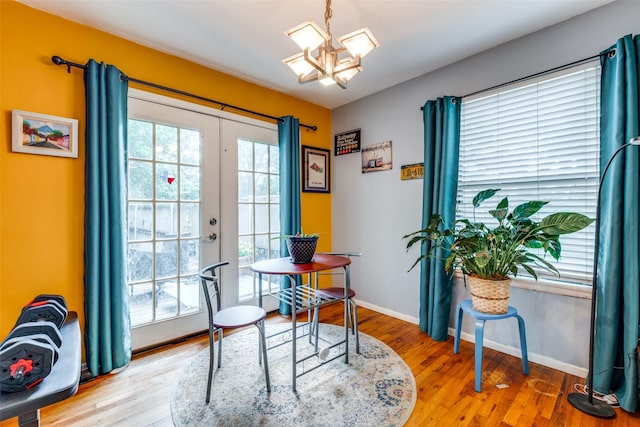 4902 N Hall St, Dallas, TX 75235 - home office featuring a chandelier, wood finished floors, and baseboards