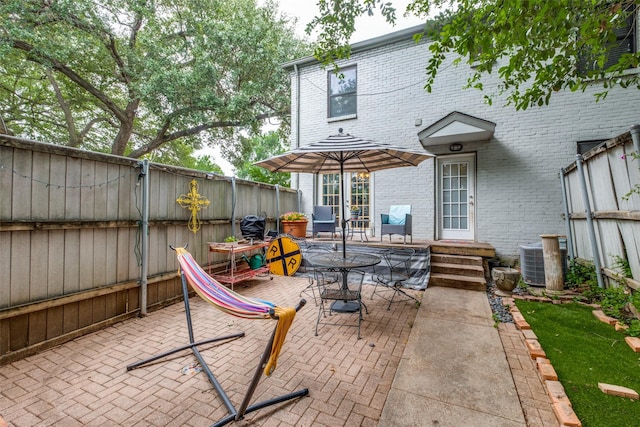 4902 N Hall St, Dallas, TX 75235 - fenced backyard with a patio, central air condition unit, and outdoor dining space