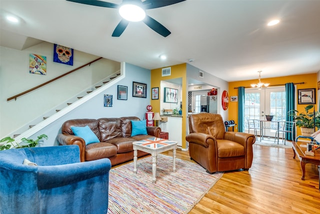 4902 N Hall St, Dallas, TX 75235 - living room with light wood finished floors, stairway, recessed lighting, a ceiling fan, and a chandelier