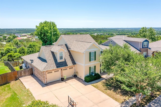 106 Camelot St, Glen Rose, TX 76043 - view of front facade featuring roof with shingles, driveway, an attached garage, and brick siding