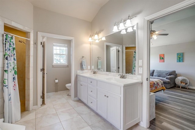 106 Camelot St, Glen Rose, TX 76043 - full bathroom featuring double vanity, ceiling fan, lofted ceiling, and a tile shower