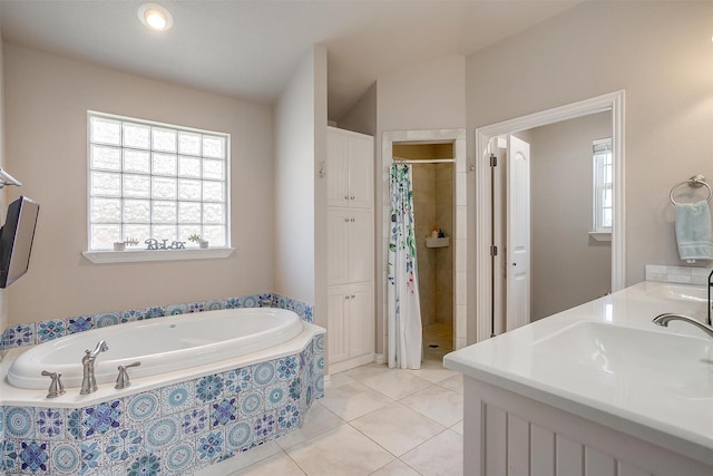 106 Camelot St, Glen Rose, TX 76043 - full bath with plenty of natural light, a stall shower, a bath, and tile patterned floors