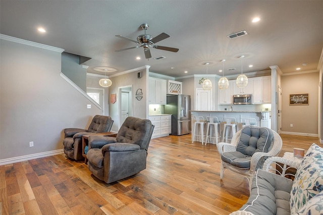 106 Camelot St, Glen Rose, TX 76043 - living area with ceiling fan, light wood finished floors, ornamental molding, and recessed lighting
