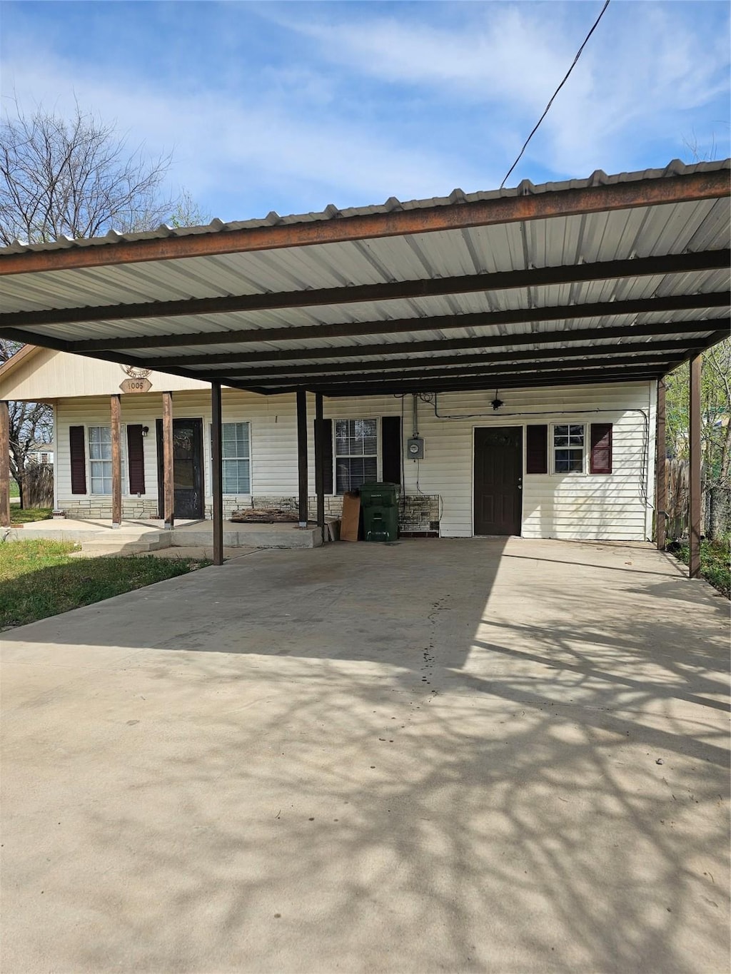 1005 8 1/2 St, Mineral Wells, TX 76067 - view of vehicle parking featuring an attached carport