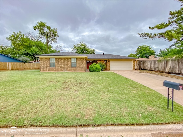 2850 Button Willow Ave, Abilene, TX 79606 - ranch-style house featuring an attached garage, driveway, and brick siding