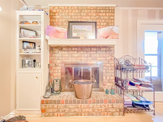 2850 Button Willow Ave, Abilene, TX 79606 - living room featuring a brick fireplace, ornamental molding, and built in shelves