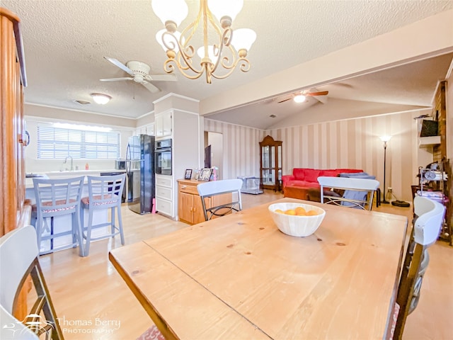 2850 Button Willow Ave, Abilene, TX 79606 - dining area with ceiling fan, wallpapered walls, a textured ceiling, a chandelier, and lofted ceiling