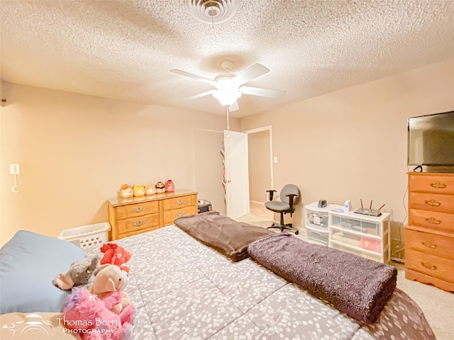 2850 Button Willow Ave, Abilene, TX 79606 - carpeted bedroom featuring a textured ceiling and ceiling fan