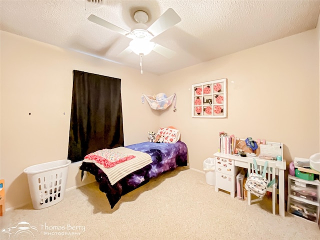 2850 Button Willow Ave, Abilene, TX 79606 - bedroom featuring carpet floors, ceiling fan, and a textured ceiling
