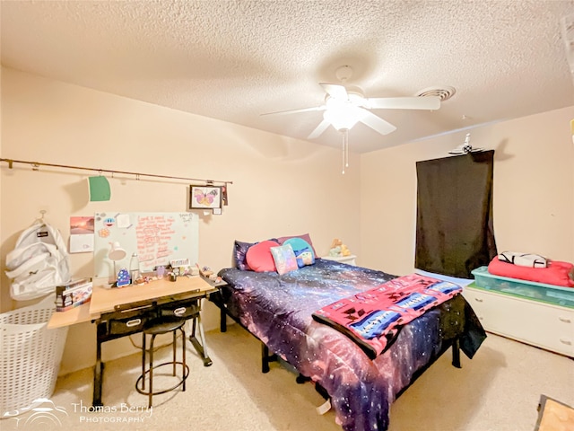 2850 Button Willow Ave, Abilene, TX 79606 - bedroom featuring carpet floors, a textured ceiling, and a ceiling fan
