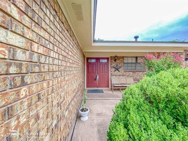 2850 Button Willow Ave, Abilene, TX 79606 - doorway to property featuring brick siding and a porch