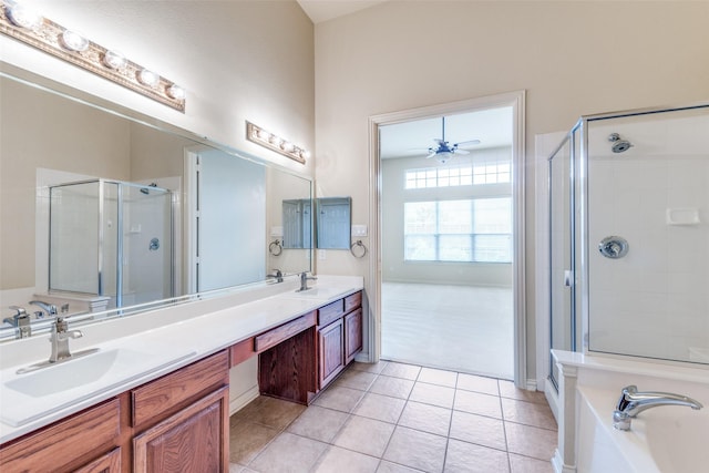 1728 Sandpiper Ln, Carrollton, TX 75007 - full bath with a stall shower, double vanity, a garden tub, a ceiling fan, and tile patterned floors