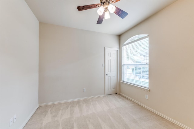 1728 Sandpiper Ln, Carrollton, TX 75007 - spare room with plenty of natural light, light carpet, a ceiling fan, and baseboards
